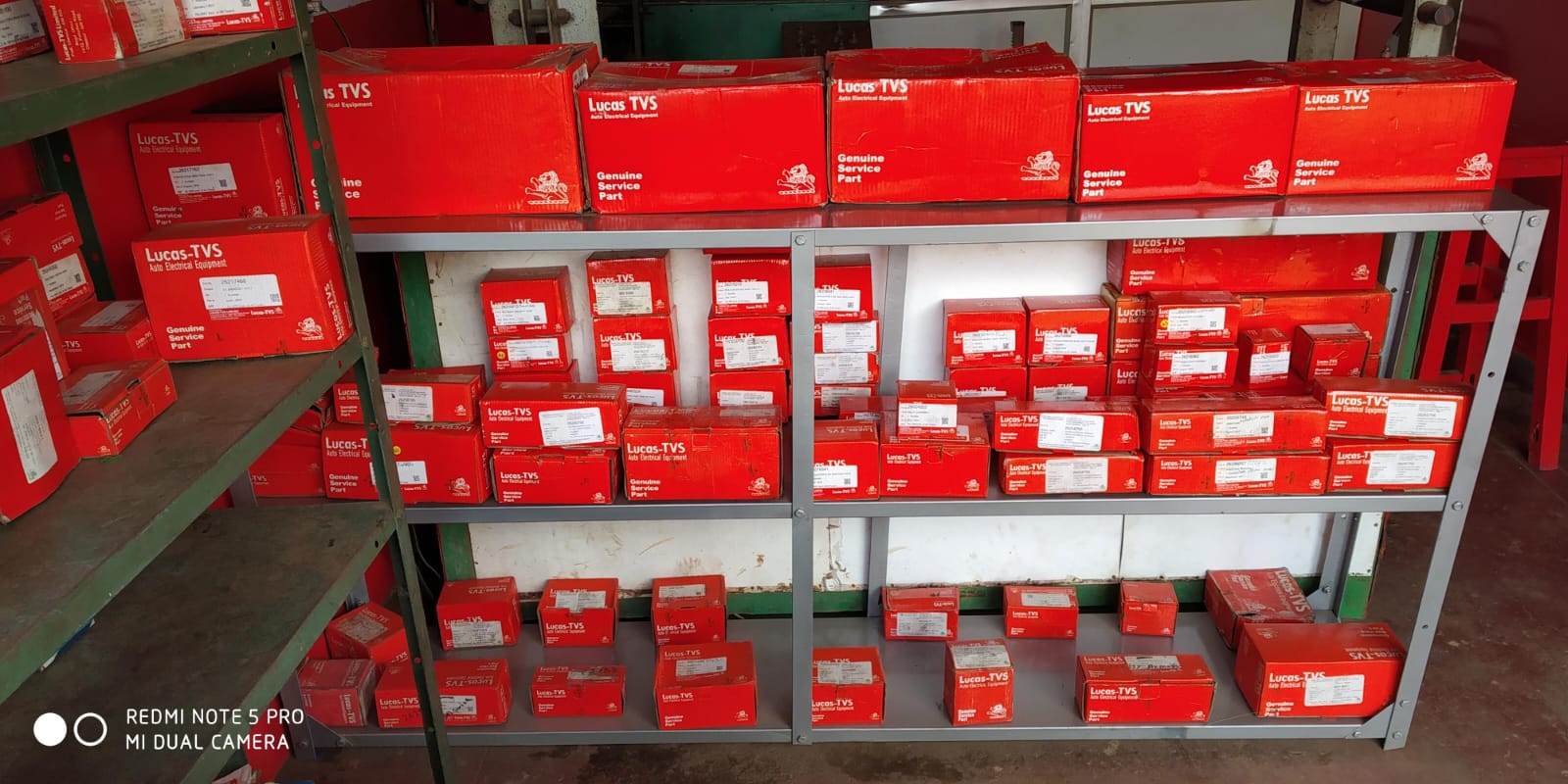 Shelves stocked with genuine Lucas TVS service parts in Belagavi